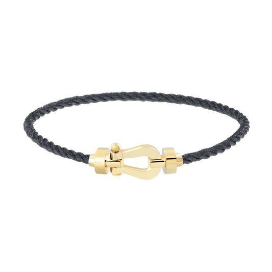 Bracelet boucle dorée sur cordon noir luxe