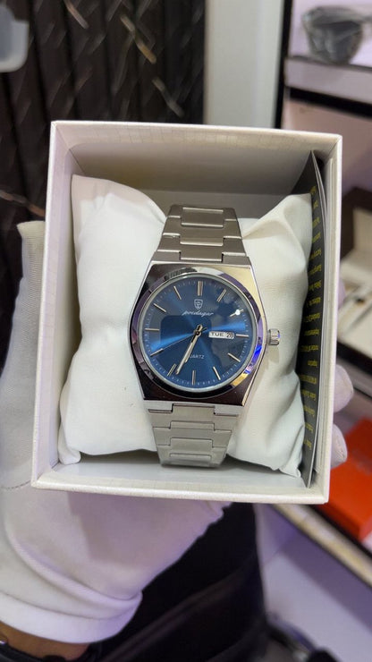Montre de luxe Poedagar pour homme avec cadran bleu soleillé, affichage date et jour, et bracelet en acier inoxydable argenté.
